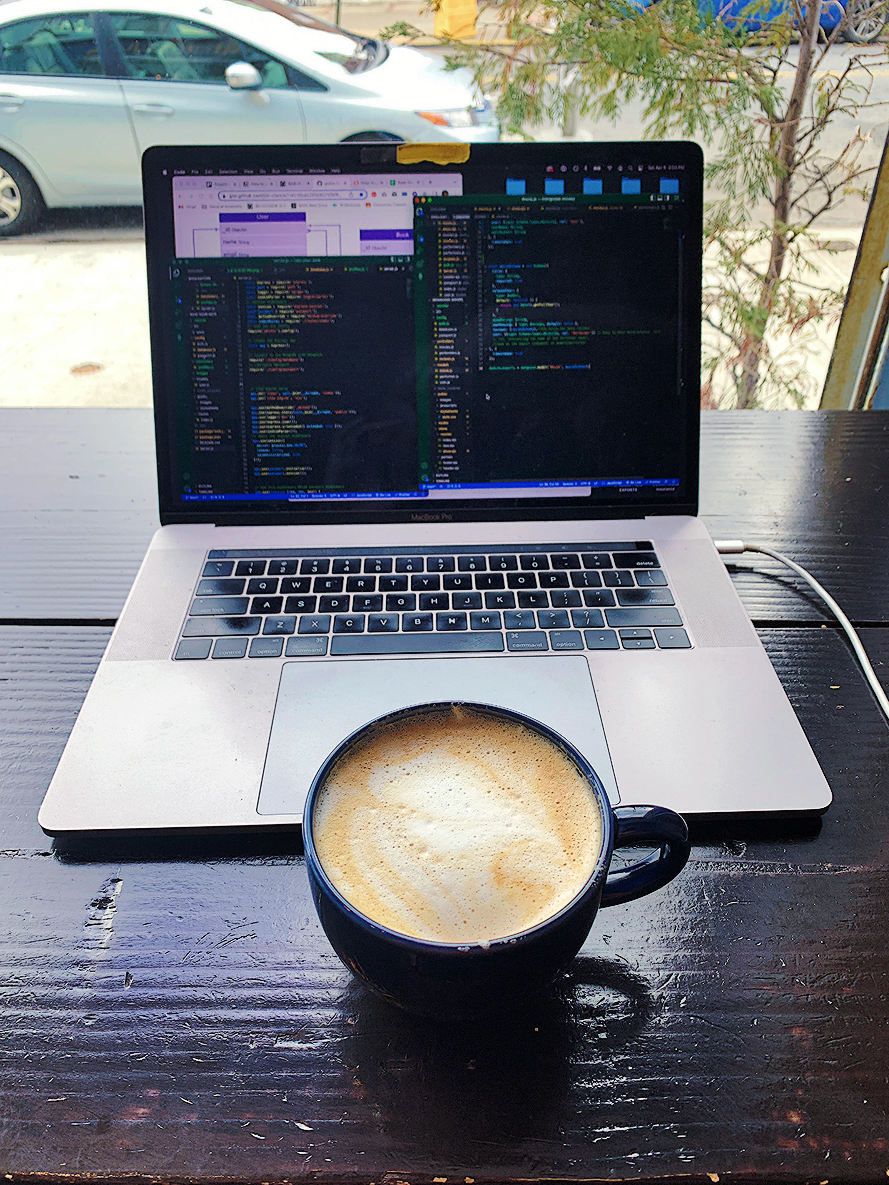 Laptop displaying code on a desk